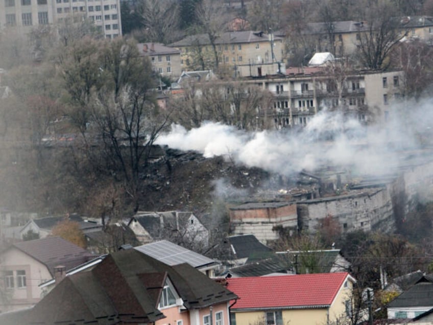 A pillar of smoke rises over a garage cooperative damaged by the Russian missile strike in