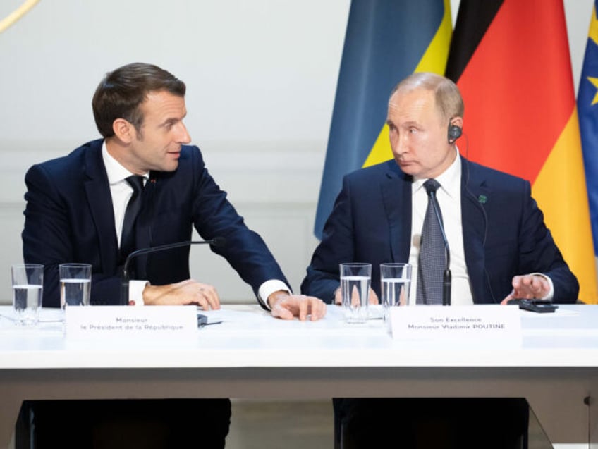 Emmanuel Macron, France's president, left, speaks beside Vladimir Putin, Russia's president, during a news conference following a 4-way summit on Ukraine at Elysee Palace in Paris, France, on Monday, Dec. 9, 2019. Putin and his Ukrainian counterpart Volodymyr Zelenskiy breathed new life into efforts to end the violence in eastern …