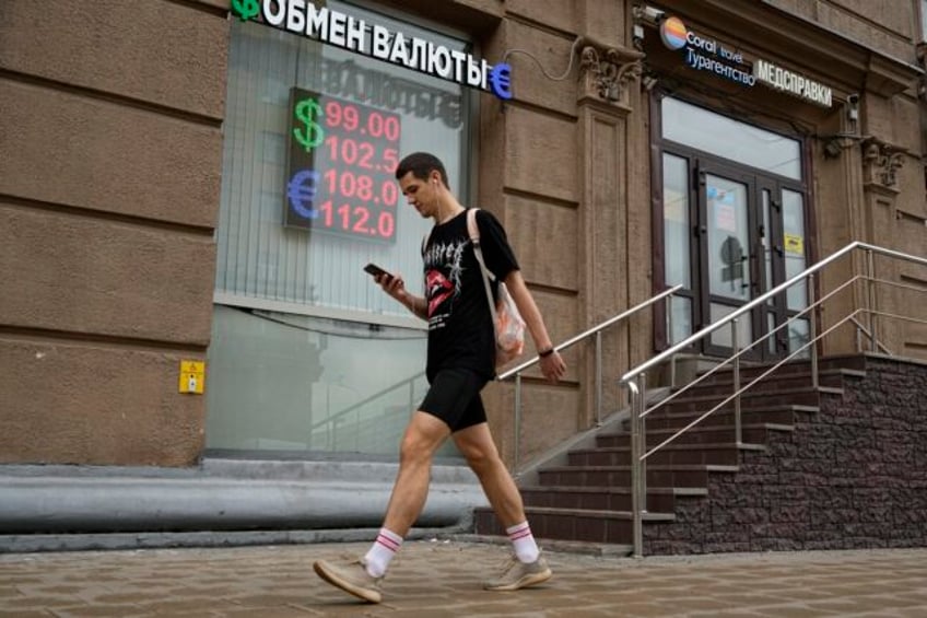 russias ruble has tumbled what does it mean for the wartime economy