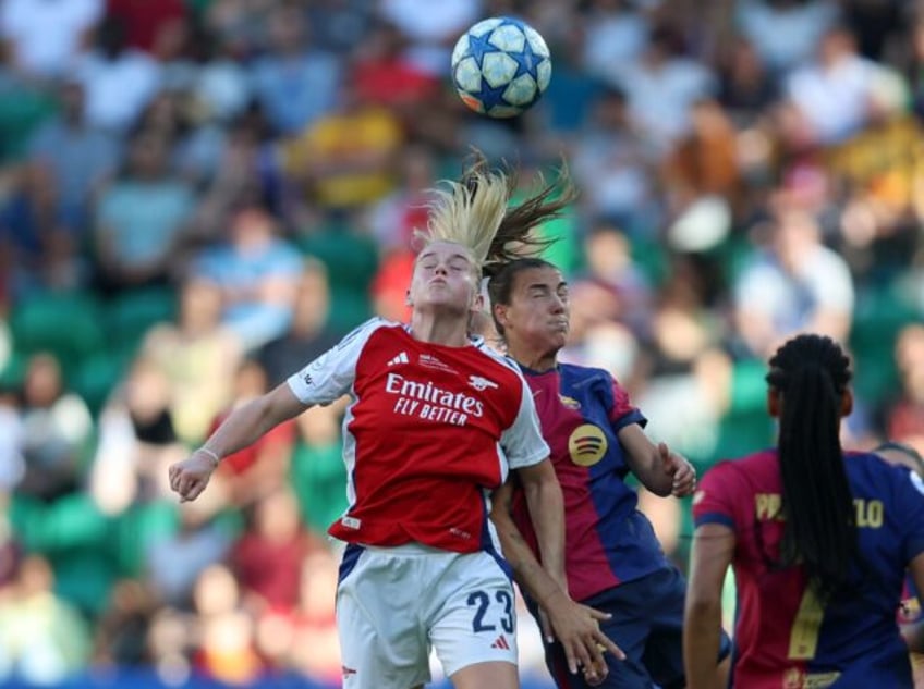 Arsenal striker Alessia Russo and Barcelona midfielder Patricia Guijarro jump for the ball