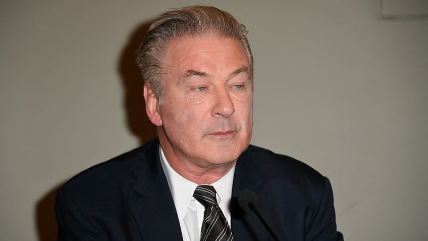 Actor Alec Baldwin wears blue suit and tie at Torino Film Festival in Italy