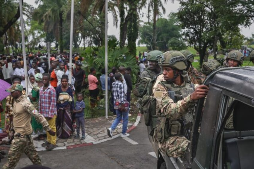 M23 fighters arrive at a protest of the Congolese government in Goma