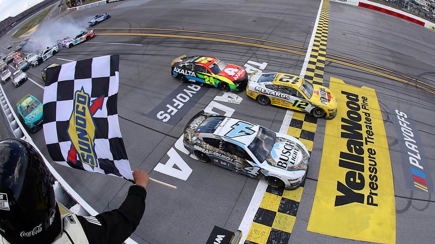 ryan blaney wins talladega by 0012 kevin harvick dqd over windshield issue