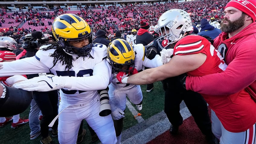 Michigan OSU players fighting