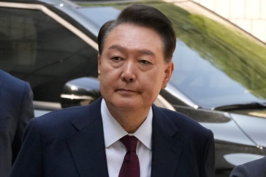 South Korea's ousted President Yoon Suk Yeol arrives at the Seoul Central District Court o