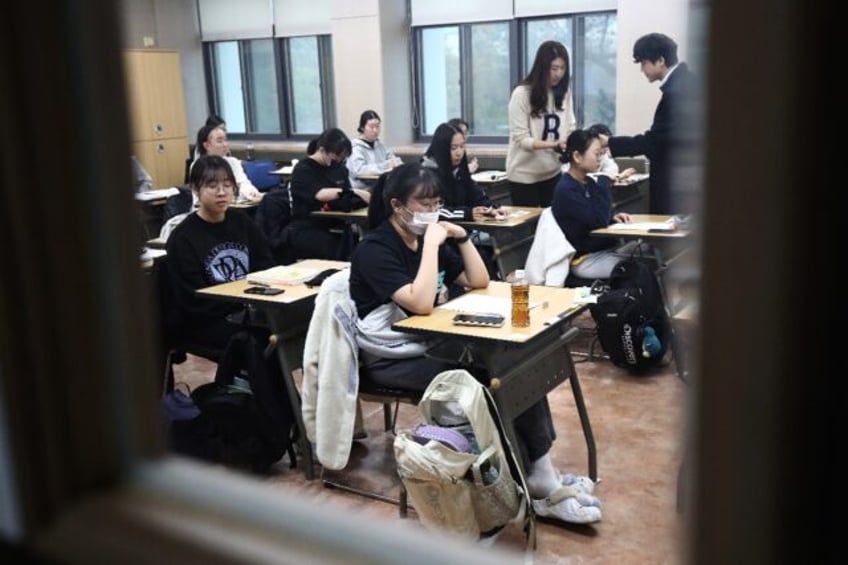 s koreans sit key exam as flights halted to limit distraction