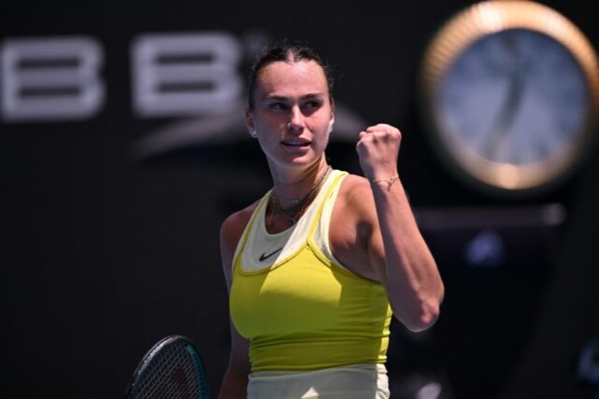 Aryna Sabalenka celebrates beating Mirra Andreeva