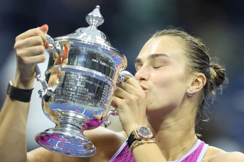 Champion: Aryna Sabalenka kisses the trophy after defeating Jessica Pegula in the US Open