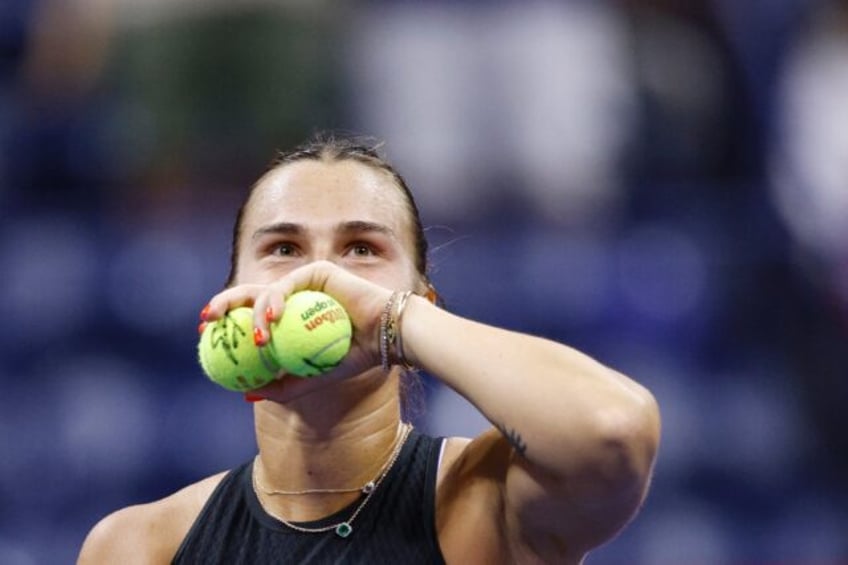 Crowd favourite: Aryna Sabalenka prepares to throw signed tennis balls to fans after defea