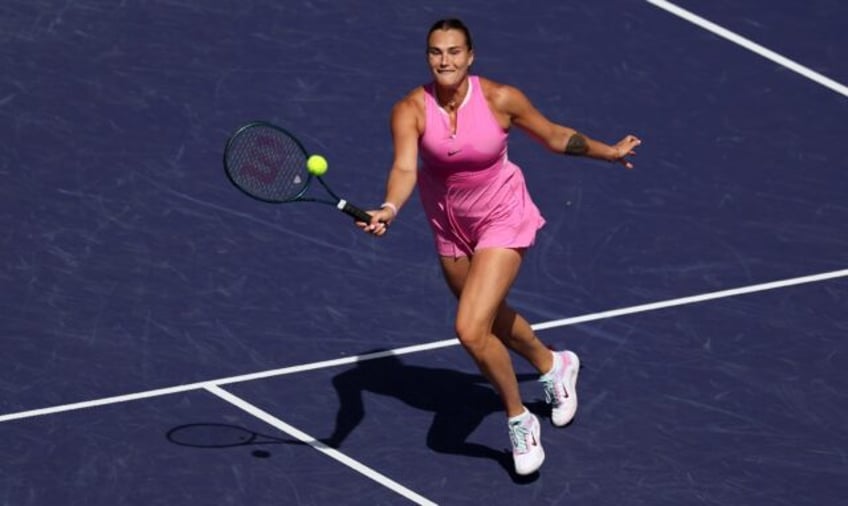 Aryna Sabalenka plays a forehand volley on her way to a straight sets victory over Emma Ra