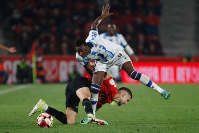 Firing blanks: Real Sociedad forward Umar Sadiq (R) battling with Mallorca defender Jose Manuel Copete