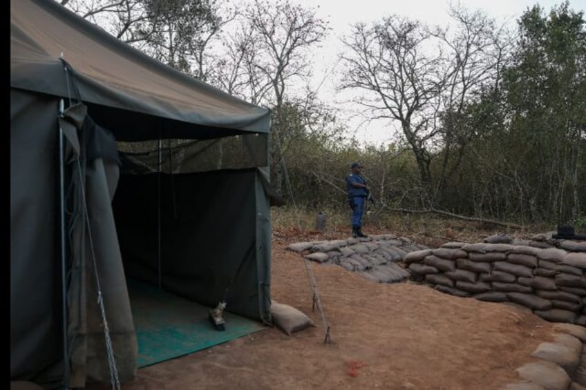 Armed South African police guarded the site following the raid