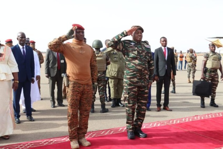 Niger's General Abdourahamane Tiani (R) with Burkinabe counterpart Captain Ibrahim Traore