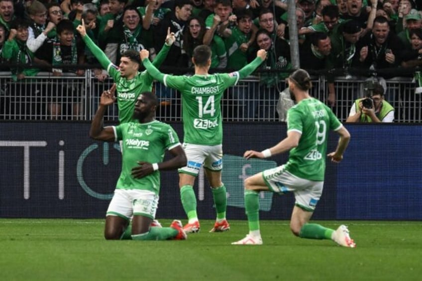 Saint-Etienne players celebrate during the French L1-L2 play-off match against Metz