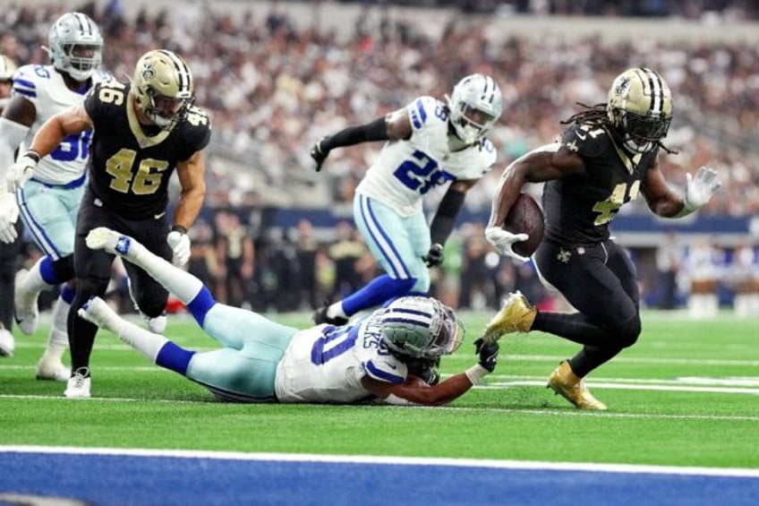 Alvin Kamara of New Orleans runs for a touchdown in the Saints' NFL victory over the Dalla