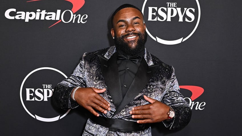 Mark Ingram smiles on red carpet