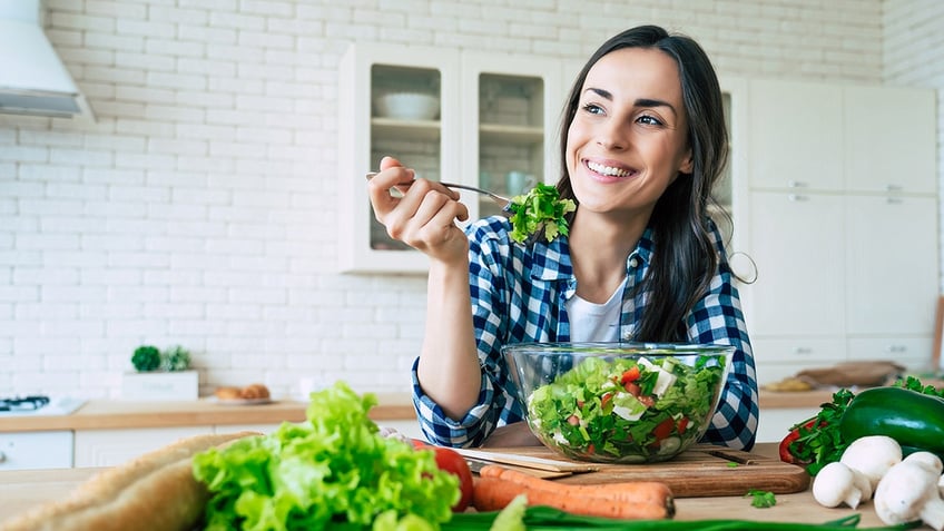 Woman eating salad