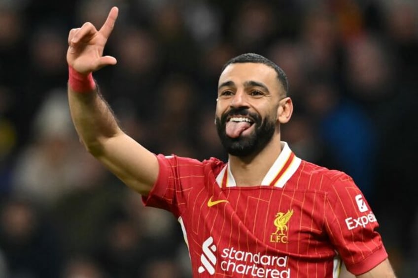 Liverpool's Mohamed Salah celebrates after scoring against Tottenham