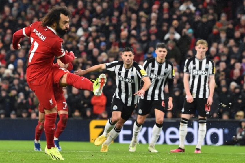 Mohamed Salah (left) scored twice after missing a first-half penalty in Liverpool's 4-2 win over Newcastle