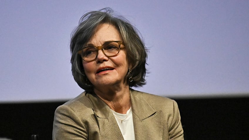 Sally Field wearing a beige blazer and a white blouse