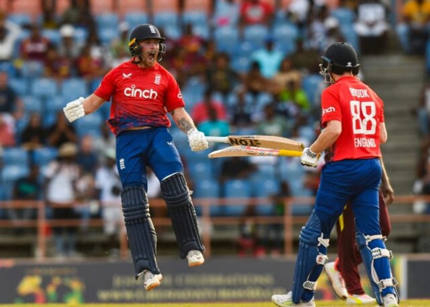 England batsmen Phil Salt (left) and Harry Brook (right)celebrate winning the third T20 international against West Indies on Saturday between West Indies and England at Grenada National Cricket Stadium, Saint George's, Grenada, on December 16, 2023.