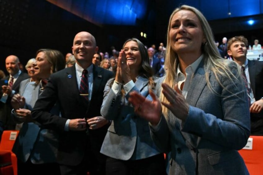 The Salt Lake City delegation including former skier Lindsey Vonn celebrate being awarded