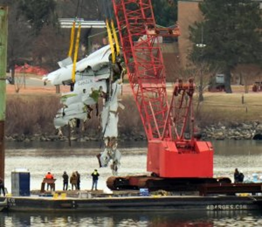 Salvage crews lift portion of fuselage of American Airlines plane from Potomac