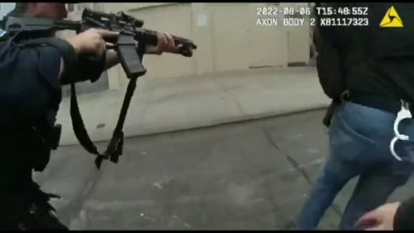 san francisco police accused of racial bias in arrest of armed suspect firing at them on bodycam