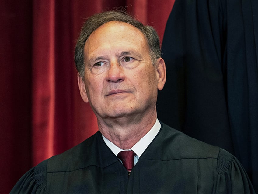 Associate Justice Samuel Alito sits during a group photo at the Supreme Court in Washington, Friday, April 23, 2021. (Erin Schaff/The New York Times via AP, Pool)