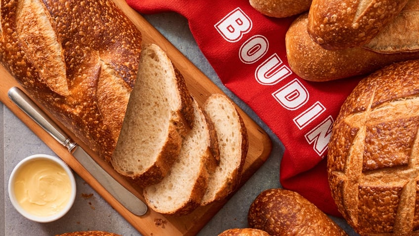 Sourdough bread sliced up on a board with a 'Boudin' banner.