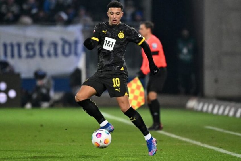 Dortmund forward Jadon Sancho set up a goal for Marco Reus just after coming on in Saturday's 3-0 win at Darmstadt