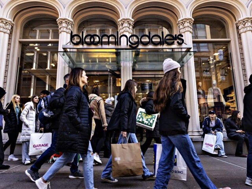 Shoppers walk past a Bloomingdale's store in the SoHo neighborhood of New York, US, on Wednesday, Dec. 28, 2022. Retail sales in the US during the holiday shopping season from November 1 to December 24 were up by 7.6% from a year before, according to the Mastercard SpendingPlus survey. Photographer: …