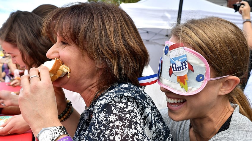 woman feeding another a fluffernutter