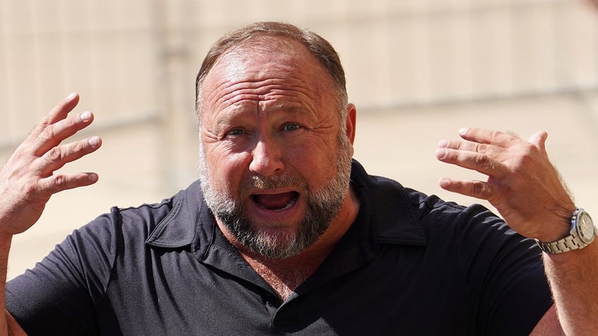 sandy hook families slam alex jones over indefinite bankruptcy after order to pay 14 billion