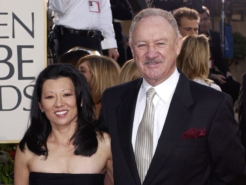 FILE - Actor Gene Hackman arrives with his wife, Betsy Arakawa, for the 60th Annual Golden