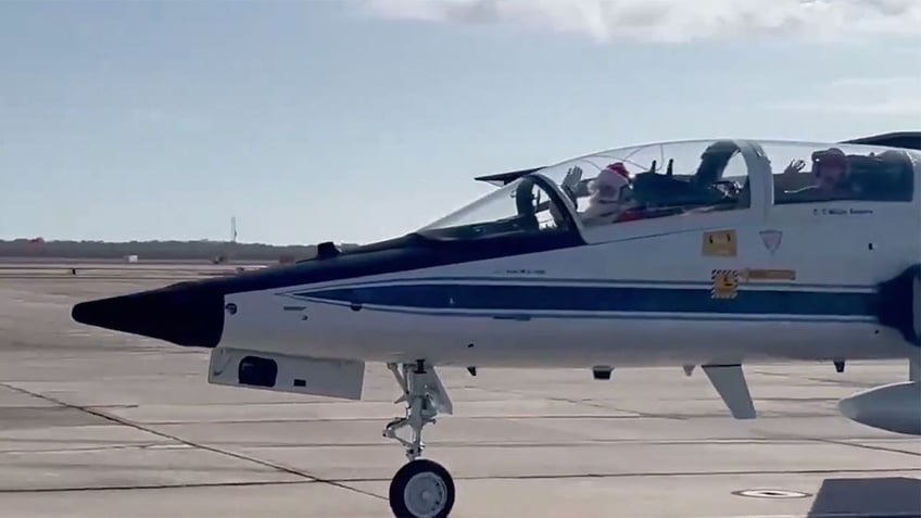 Santa waves from jet in Texas