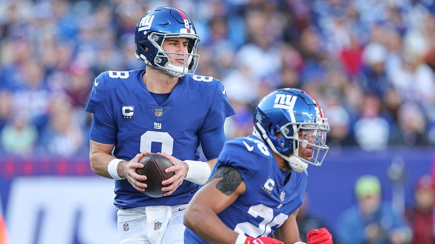 Daniel Jones and Saquon Barkley in action