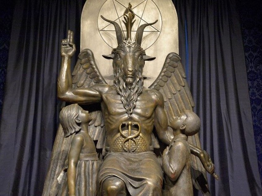 The Baphomet statue is seen in the conversion room at the Satanic Temple where a "Hell House" is being held in Salem, Massachusetts, on October 8, 2019. - The Hell House was a parody on a Christian Conversion centre meant to scare atheist and other Satanic Church members. (JOSEPH PREZIOSO/AFP …