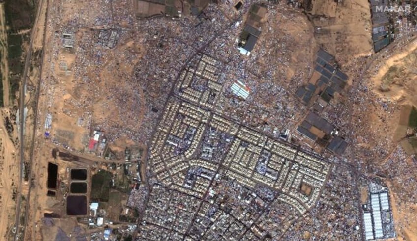 This satellite image provided by Maxar Technologies shows an overview of tents, shelters a