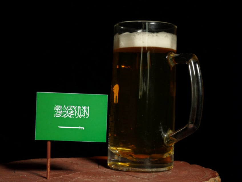 Saudi Arabian flag with beer mug isolated on black background