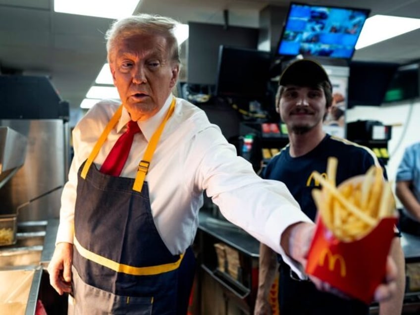 Former President Donald Trump as he works behind the counter during a visit to McDonalds i