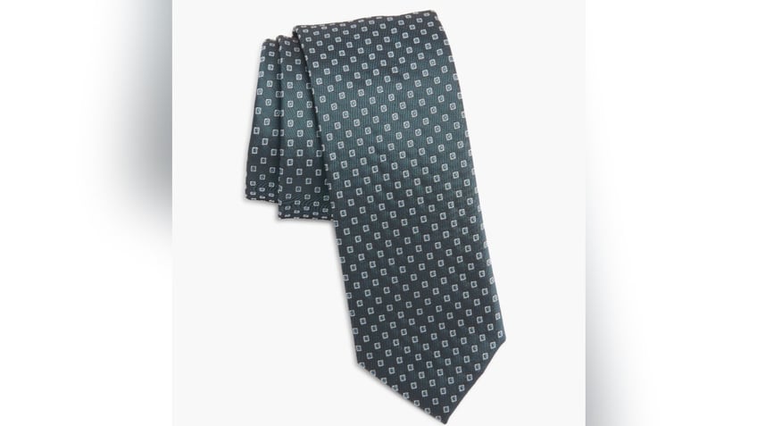 This silk tie elevates any look.