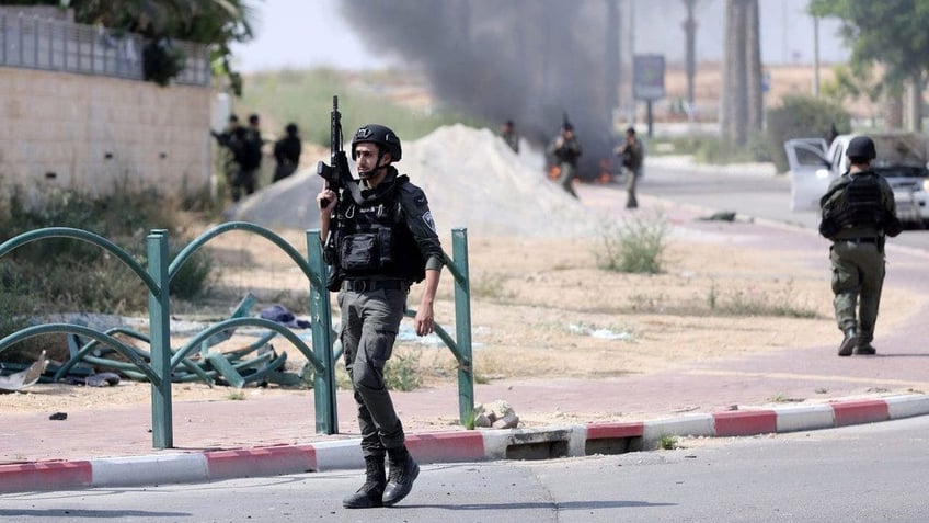 Israeli soldier seen walking down a street