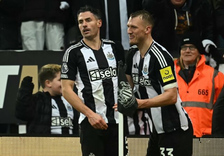 Newcastle's Fabian Schar (L) celebrates scoring against Liverpool