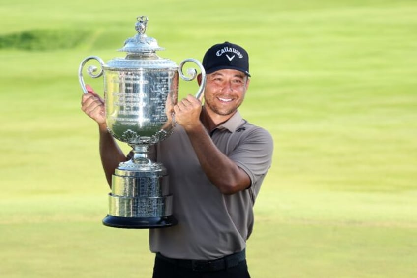 American Xander Schauffele holds the Wanamaker Trophy after winning the PGA Championship a