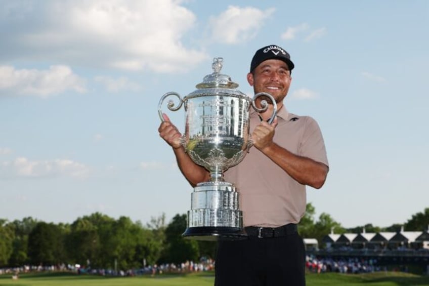 American Xander Schauffele, posing with the Wanamaker Trophy after winning his first major