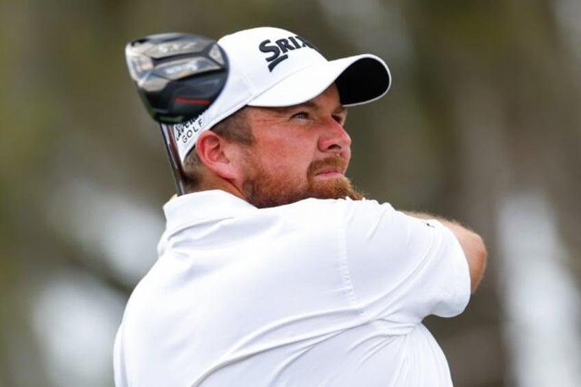 Ireland's Shane Lowry grabbed a share of the lead with top-ranked Scottie Scheffler of the