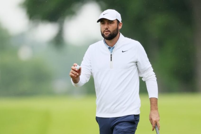 World number one Scottie Scheffler reacts after a birdie at the par-5 10th hole in the sec