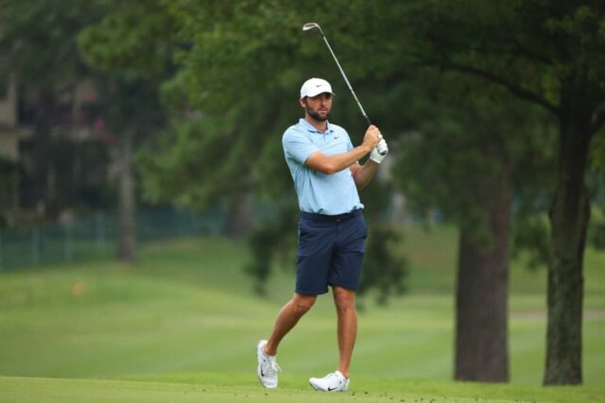 Top-ranked Scottie Scheffler watches a shot during a practice round at the St. Jude Champi