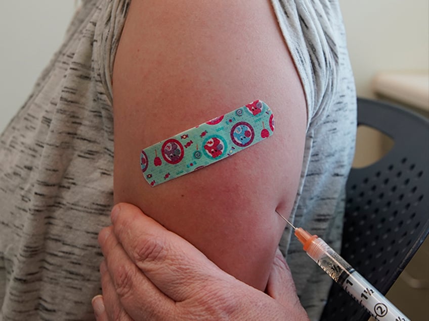 PROVO, UT - APRIL 29: A nurse gives Michaella a measles, mumps and rubella virus vaccine m